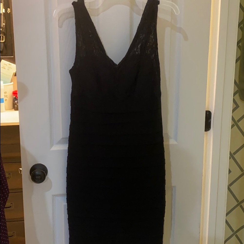 Black sheath dress with lace top, pleated bottom